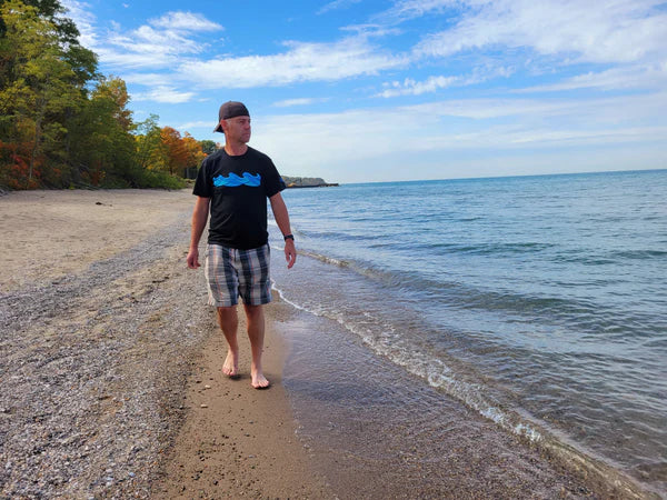  Model wearing a South Shore Co.™ grey coordinates tee featuring the Sarnia, Ontario design and anchor hat; lakeside lifestyle apparel from the Tees collection.